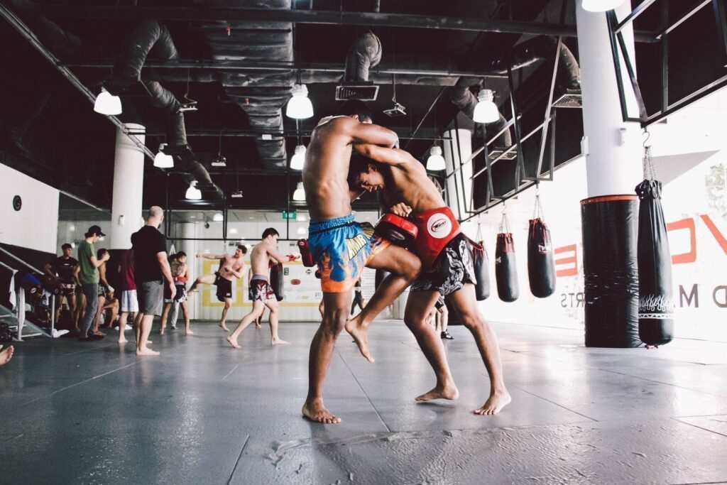 ONE Superstar Amir Khan practices his knees in the clinch with multiple-time Muay Thai World Champion Penek Sitnumnoi.