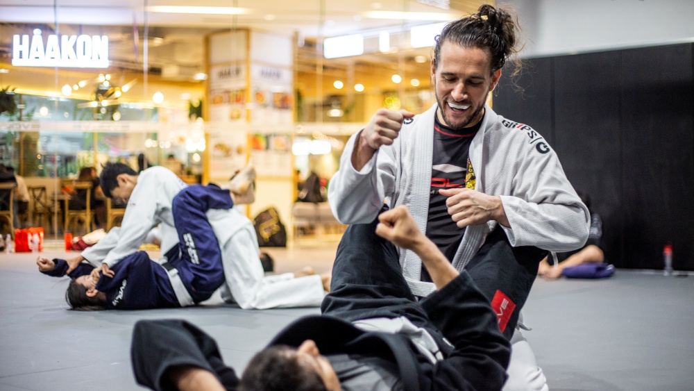 bjj students in gi fist bumping