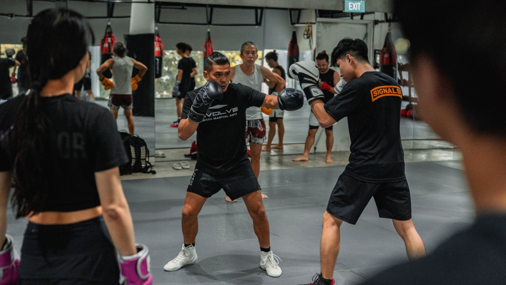 WBA Boxing World Champion Drian Francisco teaching a boxing class at Evolve Far East Square.